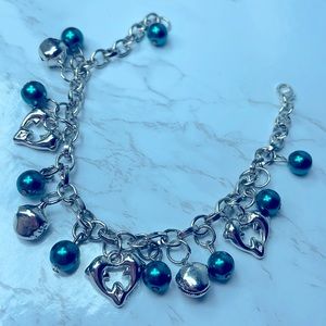 Jingle bell and dolphin charm bracelet. Great Christmas gift or Xmas accessory.